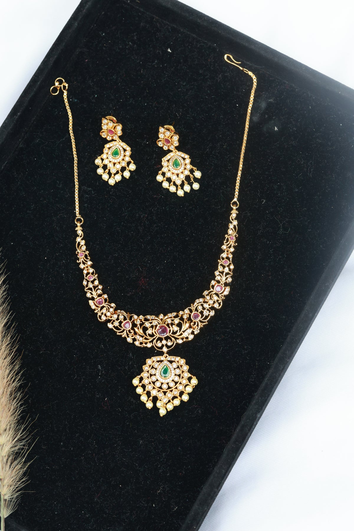 Hastak - Vibrant ruby and emerald-toned stones