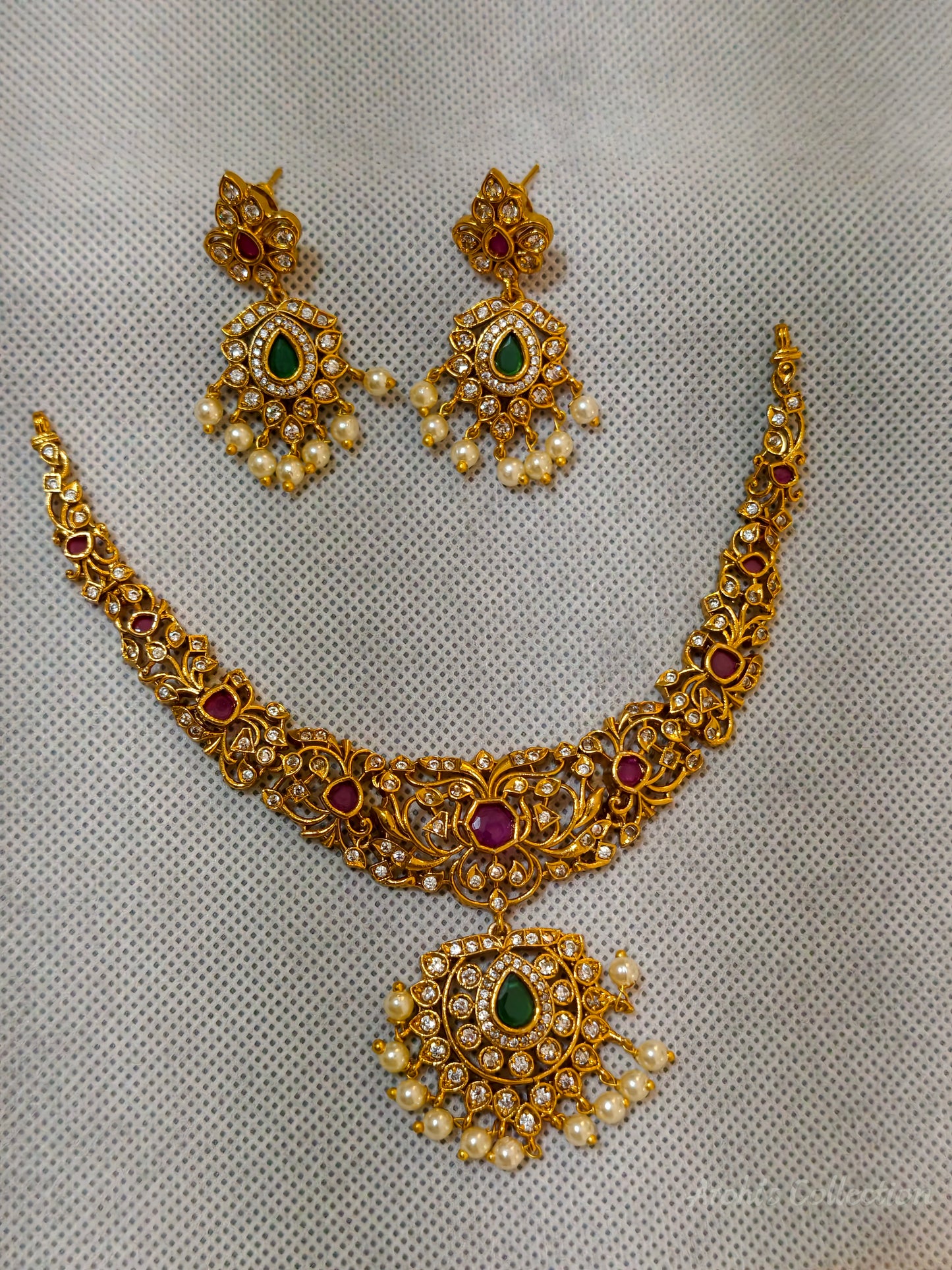 Hastak - Vibrant ruby and emerald-toned stones