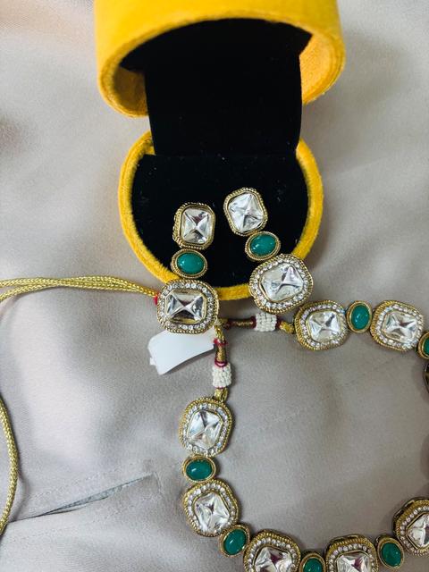 Elegant Kundan Jewelry Set with Green Accents
