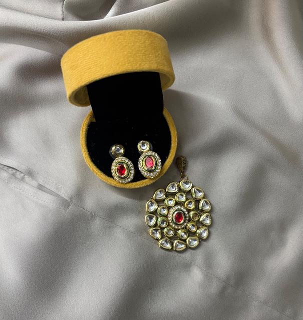 Elegant Kundan Jewelry Set with Red Accents