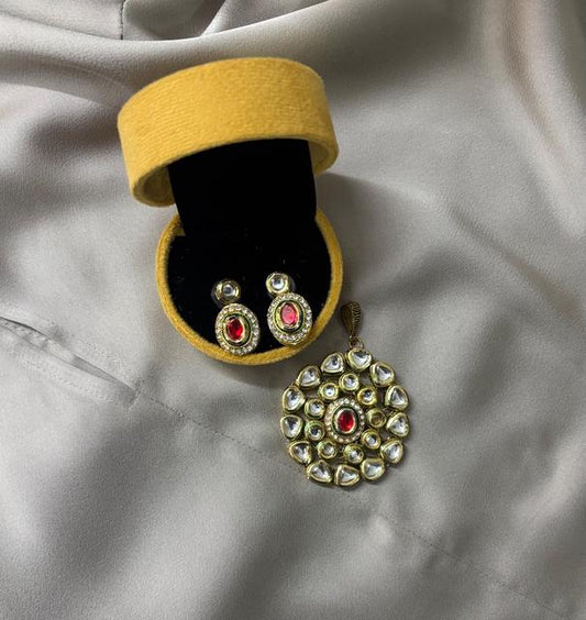 Elegant Kundan Jewelry Set with Red Accents