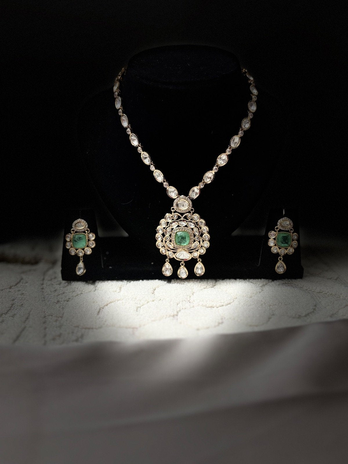 Elegant Kundan Jewelry Set with Green Accents