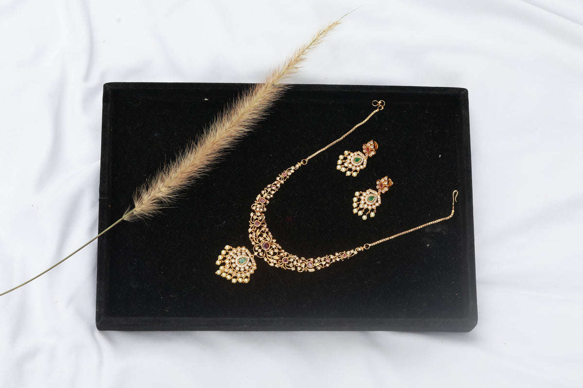 Hastak - Vibrant ruby and emerald-toned stones
