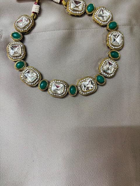 Elegant Kundan Jewelry Set with Green Accents