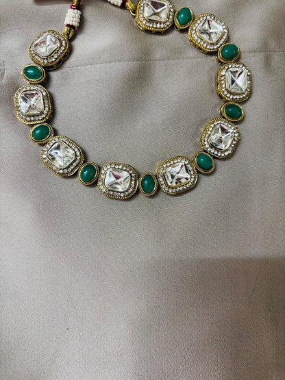 Elegant Kundan Jewelry Set with Green Accents