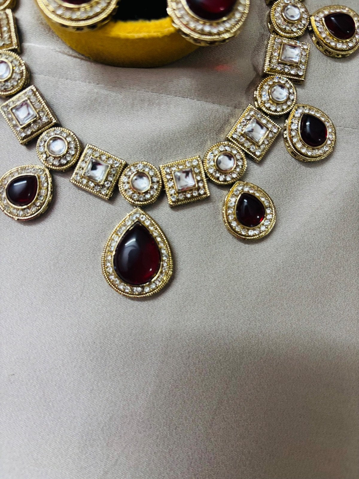 Kundan Set with Maroon coloured Doublets