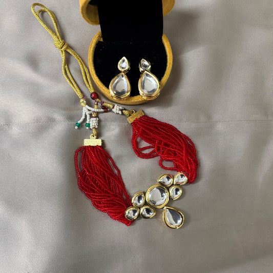 Elegant Kundan Jewelry Set with Red Thread Necklace