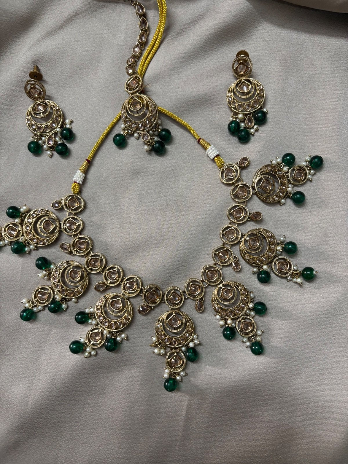 Elegant Kundan Jewelry Set with Green Beads