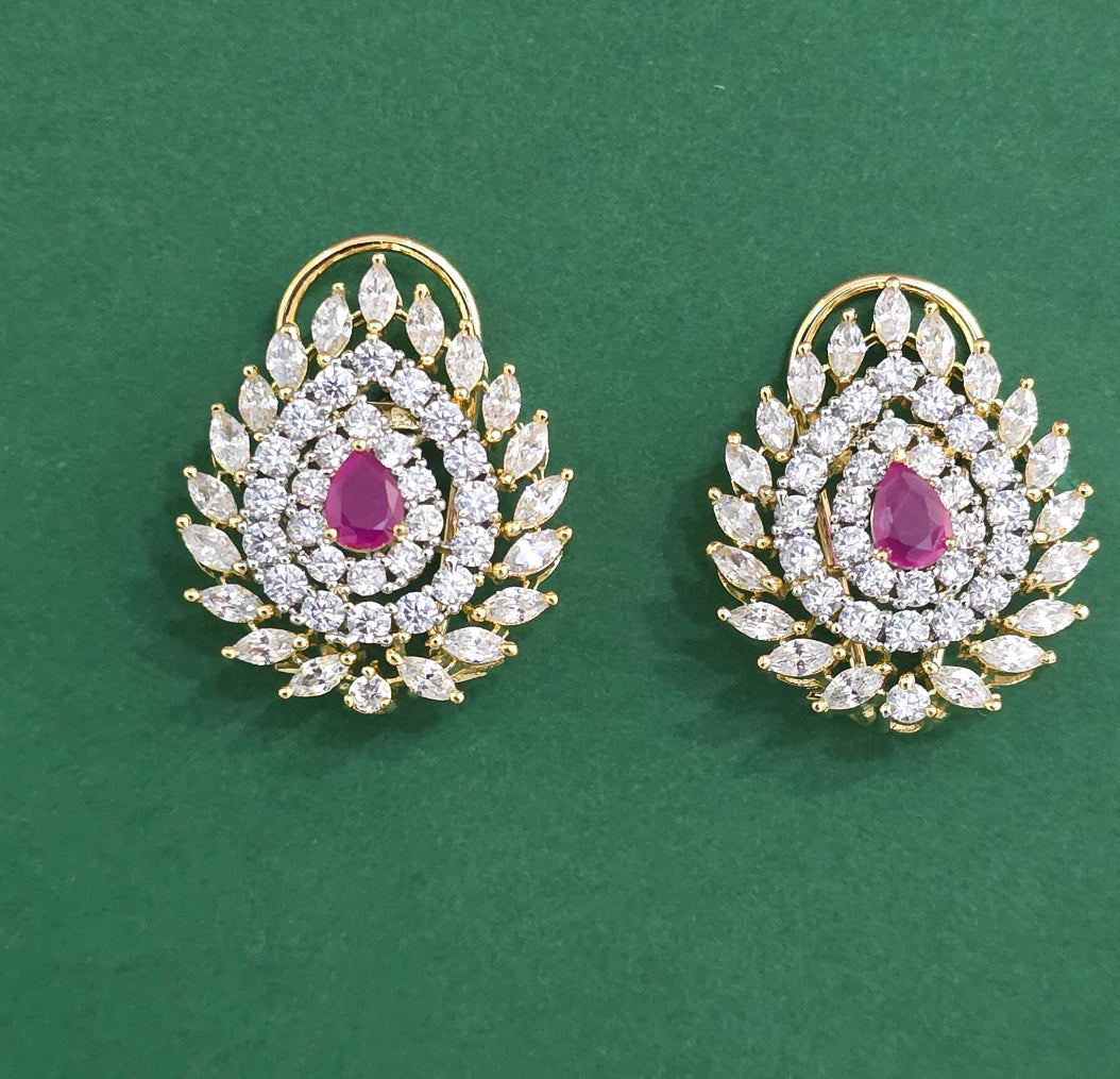 Zircon Studs With Rubi Colored Center Stone
