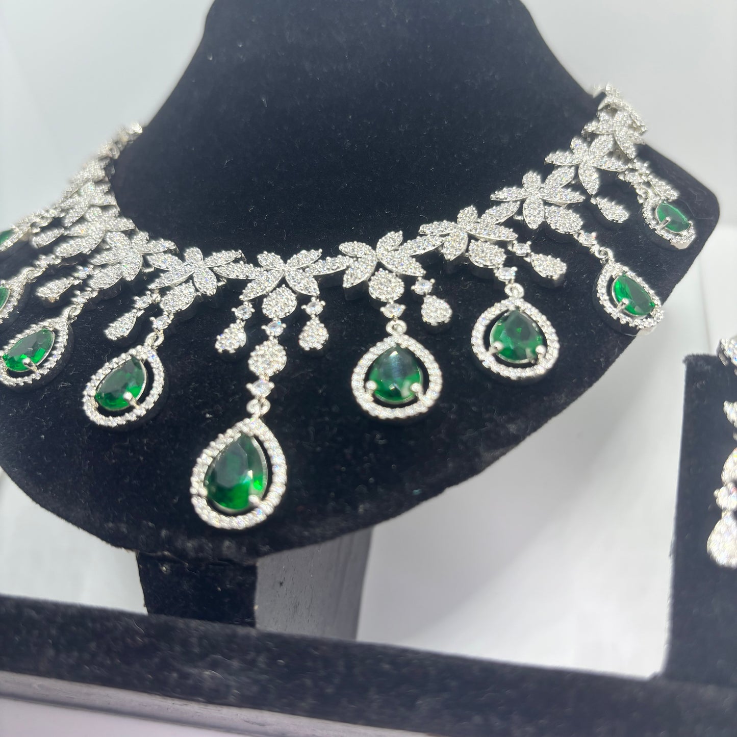 Intricate floral and leaf motifs crafted from brilliant-cut marquise crystals