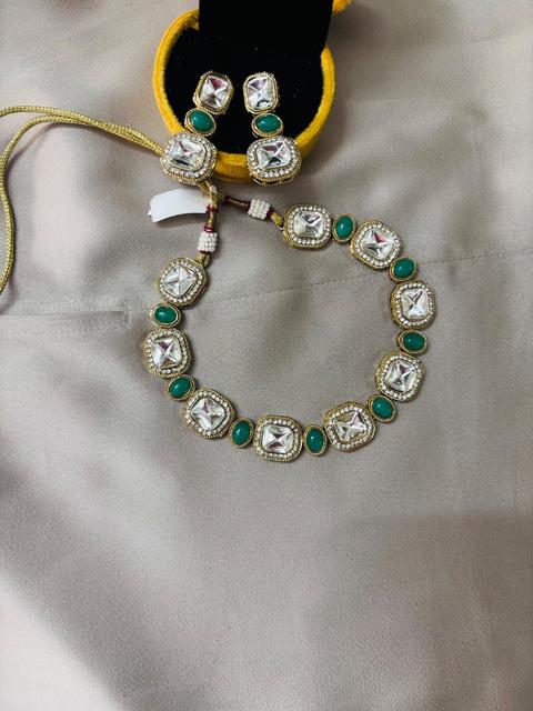 Elegant Kundan Jewelry Set with Green Accents