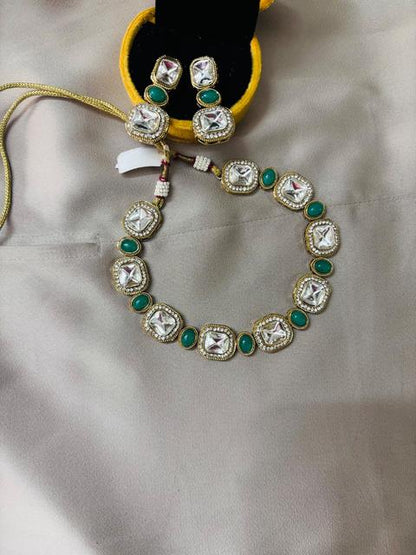 Elegant Kundan Jewelry Set with Green Accents