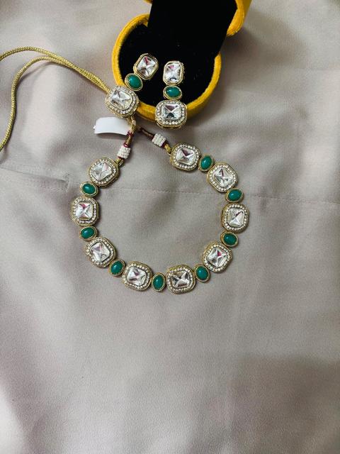 Elegant Kundan Jewelry Set with Green Accents